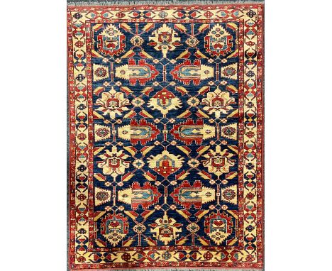 An Afghan design Shirvan type wool rug or carpet, worked in the traditional manner, 191cm x 139cm 