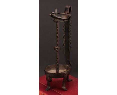 A 19th century wrought iron whale oil lamp, cut steel pillar, 37cm high 