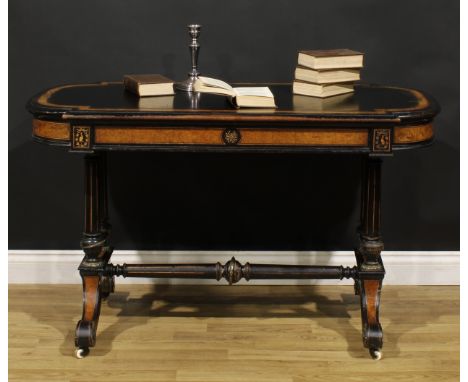 A Victorian amboyna banded ebonised library table, slightly oversailing top with moulded edge above a long frieze drawer, tur