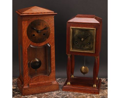 An Arts &amp; Crafts oak portico mantel clock, 9.5cm brass dial inscribed with Arabic numerals, twin winding holes, eight day