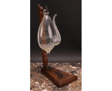 A 19th century Dutch weather glass or donderglas barometer, 23.5cm long, later folding stand 