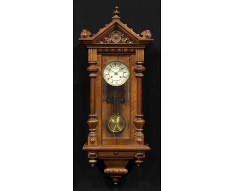 A late 19th century walnut architectural Harmonia Vienna type wall clock, 13cm circular dial inscribed with Roman numerals, t