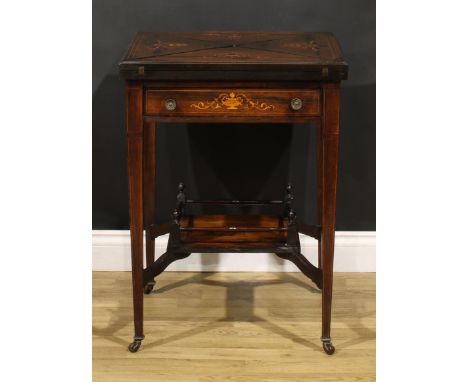 An Edwardian rosewood and marquetry envelope card table, square top with four folding leaves enclosing counter wells and a ba