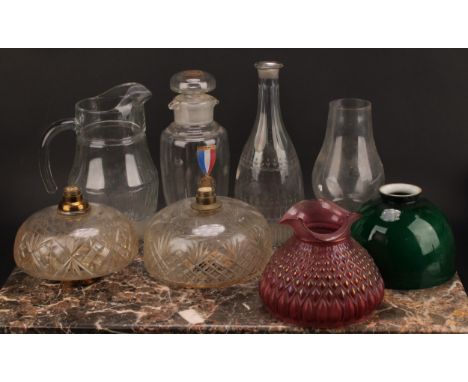 An Art Nouveau period iridescent cranberry glass lamp shade, 14.5cm diam, c.1900; oil lamp reservoirs; etc (qty) 