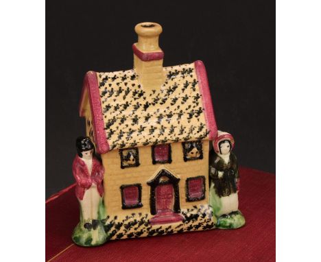 A Yorkshire Prattware polychrome spongeware cottage money box, moulded in relief with a figure to either side, five windows, 