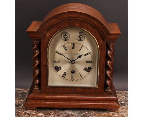 An early 20th century oak bracket clock, 14.5cm arched silvered dial inscribed A.MASON WILLIAMS &amp; CO, BRIDGEND, Roman num
