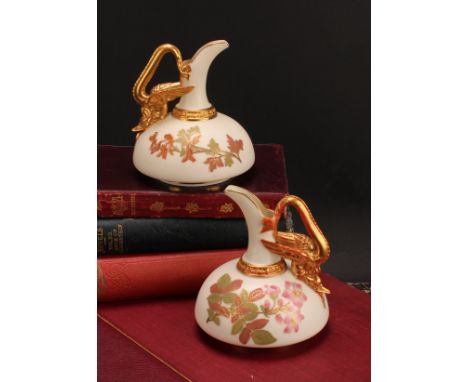 A pair of Royal Worcester ewers, of compressed form, decorated in the Aesthetic manner with flowers and foliage in muted tone