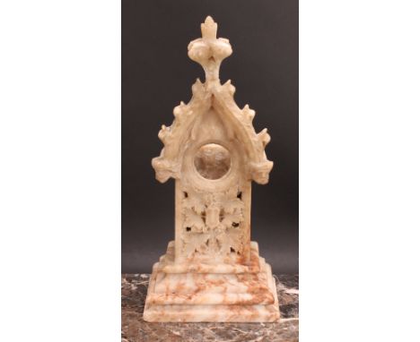 A late 19th century Gothic Revival alabaster architectural pocket watch stand, 37cm high, 16.5cm wide, 11.5cm deep, the apert