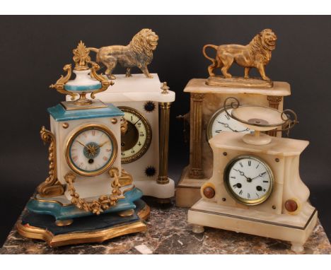 A late 19th century French alabaster mantel clock, the case crested by a lion, 36cm high, 23cm wide, 12cm deep; others (4) 