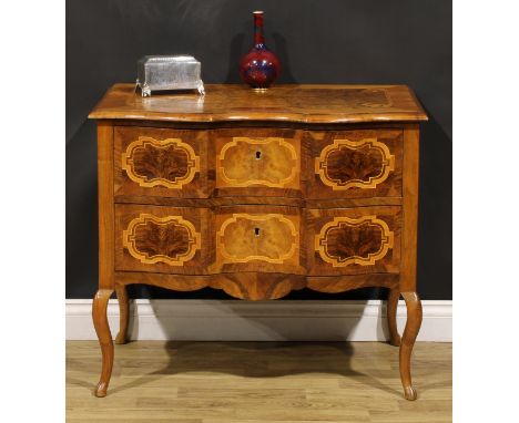 An 18th century style Italian walnut serpentine commode, oversailing top above a pair of long drawers, shaped apron, cabriole