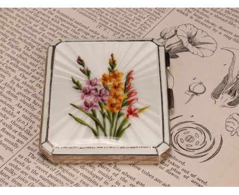 An early Elizabeth II silver and enamel canted rectangular cigarette case, hinged cover decorated in polychrome with flowers 