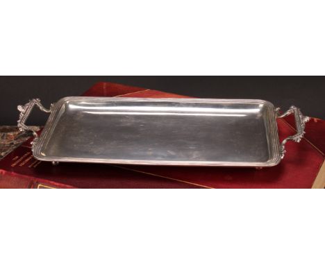 A Continental silver two-handled rounded rectangular sandwich tray, reeded border, 30.5cm wide, apparently unmarked, c.1900, 