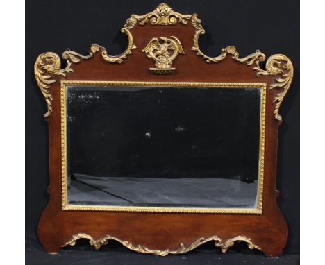 A Chippendale Revival mahogany and parcel-gilt overmantel or pier glass, bevelled mirror plate, the shaped frieze centred by 