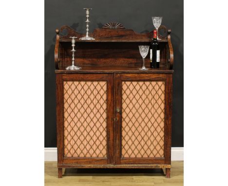 An unusual George IV simulated rosewood chiffonier, shaped superstructure with shallow shelf, above a pair of doors, applied 