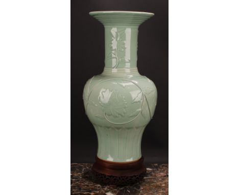 A large Chinese celadon baluster vase, moulded with lotus, 53cm high, seal mark, hardwood stand 