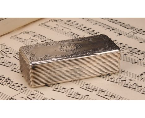 A 19th century French silver rounded rectangular snuff box, hinged cover chased with a cartouche and border of flowers and le