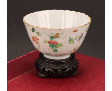 An 19th century Chinese fluted circular bowl, painted in the famille verte palette with flowers and insects, 10cm diameter, r