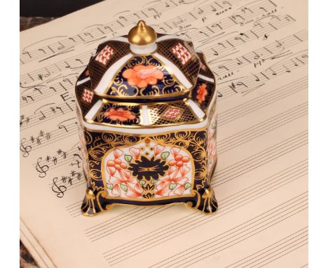 A Royal Crown Derby 1128 Imari pattern shaped square inkwell, of casket form, the domed cover enclosing removable liner, four