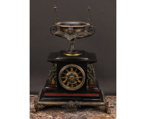 A late 19th century French dark patinated and gilt metal mounted black slate and rouge marble mantel clock, 9cm circular dial