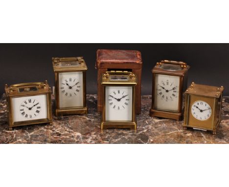 An early 20th century French lacquered brass carriage timepiece, 5.5cm enamel clock dial inscribed with Roman numerals, key-w