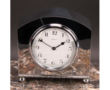 A mid 20th century French silver coloured metal mantel clock, 8cm circular enamel dial inscribed with Arabic numerals, eight 