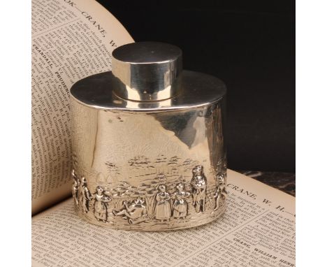 An Edwardian silver oval tea caddy, chased in the Teniers taste, push-fitting cover, 8.5cm wide, Nathan &amp; Hayes, Chester 