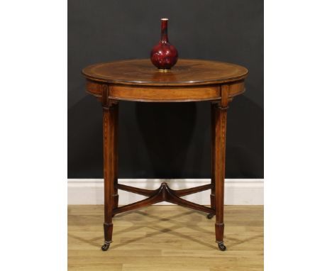 An Edwardian rosewood and marquetry centre table, circular top with moulded edge inlaid with bell husks and scrolling acanthu