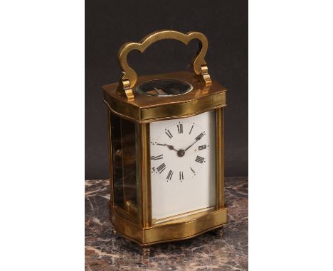 An early 20th century French lacquered brass carriage timepiece, 5.5cm enamel dial inscribed with Roman numerals, serpentine 