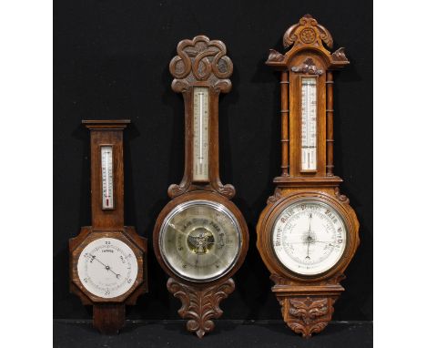 A Victorian oak aneroid wheel barometer, 19cm register inscribed Hutchinson &amp; Co, 14 Newgate St, London, mercury thermome