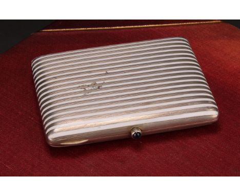 A Continental silver and enamel rounded rectangular cigarette case, banded in white, hinged cover, gilt interior, 8.5cm long,