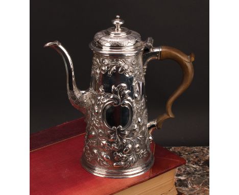 A George II silver spreading cylindrical chocolate pot, hinged cover with stirring aperture, chased with fruiting oak centred