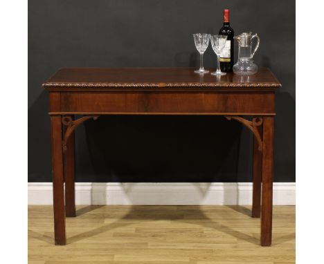 A 19th century Chippendale Revival mahogany side or serving table, rectangular top with gadrooned edge above a deep frieze, a