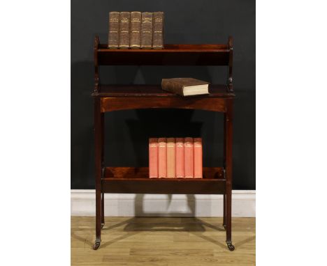 An Edwardian mahogany two-tier book trough, ceramic casters, 86cm high, 57cm wide, 23cm deep, c.1905 