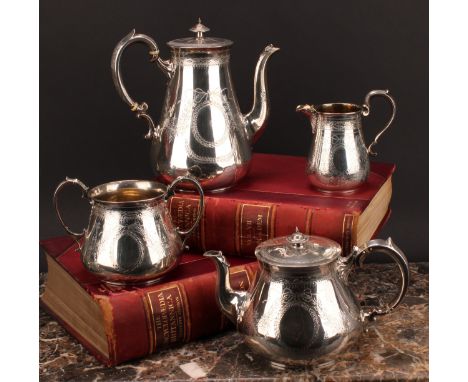 A Victorian silver four piece tea and coffee service, comprising coffee pot, tea pot, milk jug and sucrier, each bright-cut e