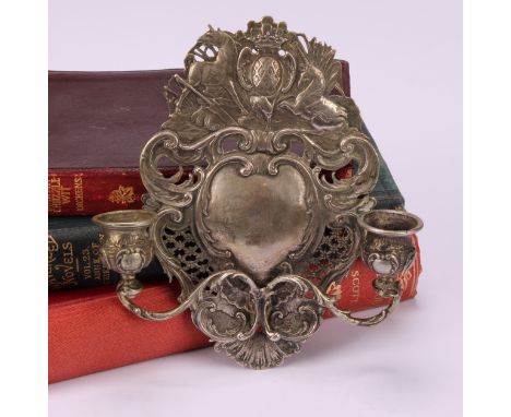 A 19th century Dutch silver girandole, of small proportions, cast in the Rococo taste, the back plate surmounted with a crest