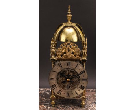 A 17th century style brass lantern timepiece, 11.5cm silvered clock dial inscribed with Roman numerals, single winding hole, 