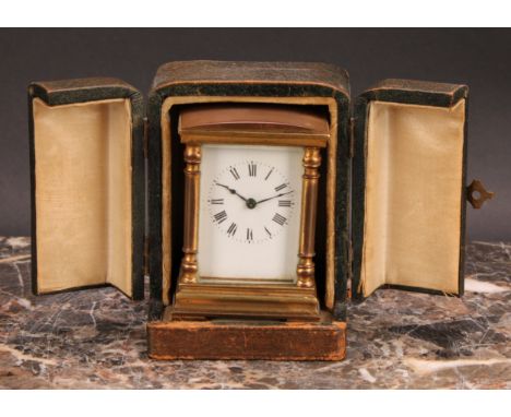An early 20th century lacquered brass miniature carriage timepiece, 4cm rectangular enamel dial inscribed with Roman numerals