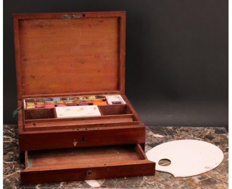 A 19th century mahogany artist's box, hinged cover enclosing a ceramic palette and provision for paint and painting requisite