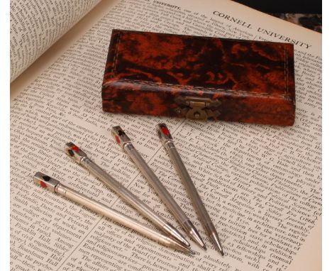 A set of four sterling silver propelling pencils/bridge scoring markers, rectangular finials applied with playing card suits,