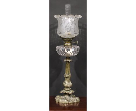 An Art Nouveau period brass table oil lamp, Hink's Duplex No.2 burner, facetted clear glass font, the column and base with st