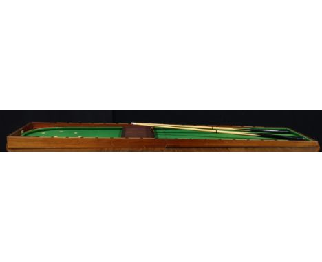An Edwardian mahogany folding bagatelle table, ivorine baize markers, retailed by A.W. Gamage Ltd, Holborn, London, E.C., ope