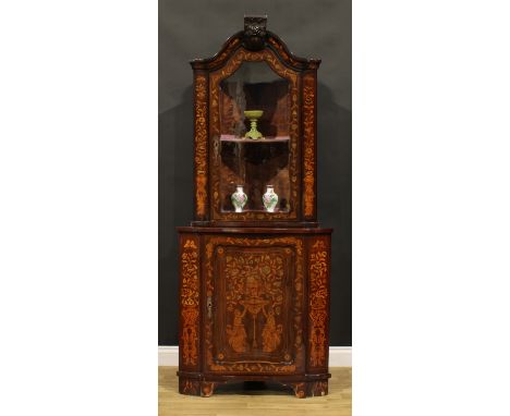 A 19th century Dutch marquetry floor standing corner display cabinet, arched cresting above a glazed door enclosing a shelf, 
