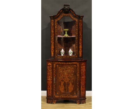 A 19th century Dutch marquetry floor standing corner display cabinet, arched cresting above a glazed door enclosing a shelf, 