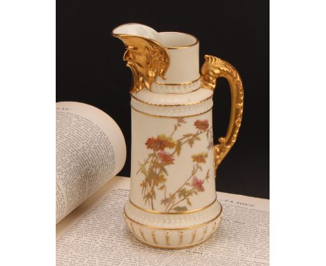 A Royal Worcester jug, decorated in the Aesthetic manner with flowers and foliage in muted tones, gilt mask spout, dolphin ha