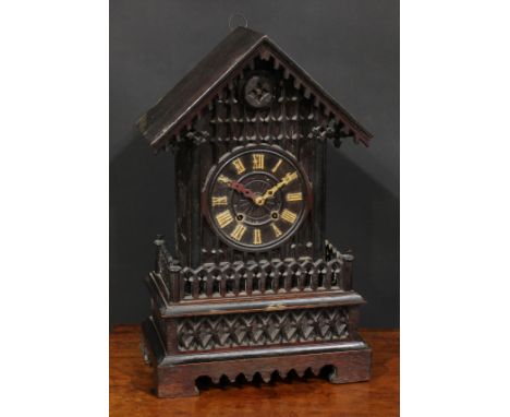 A Black Forest mantel cuckoo clock, 14cm dial applied with Roman numerals, twin winding holes, the architectural case in the 