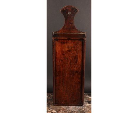A George III oak candle box, axe-head shaped cresting, sliding cover, 50cm high, c.1800 