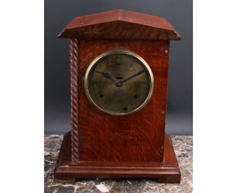 An early 20th century oak officer’s mess type mantel clock, 14.5cm circular brass dial inscribed C.W. HAMMONDS., DERBY, three