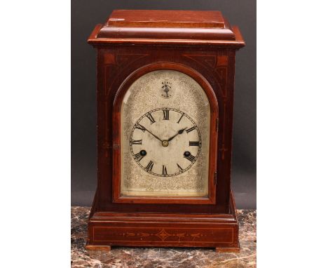 An early 20th century mahogany mantel clock, 15cm arched silvered dial inscribed with Roman numerals, Silent/Chime to arch, t