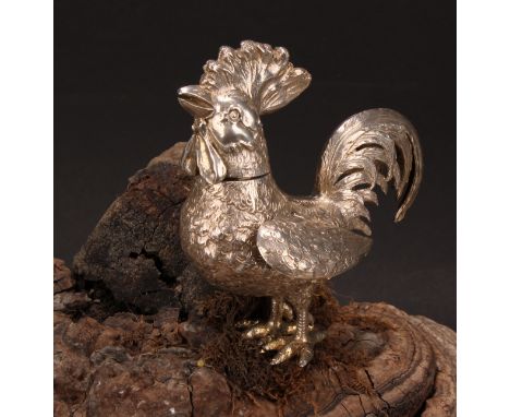 A Continental silver novelty spice canister, cast as a cockerel, articulated wings, 10cm high, marked 800, early 20th century