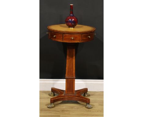 A Regency mahogany pedestal drum table, of small and neat proportions, circular top with inset tooled and gilt leather writin